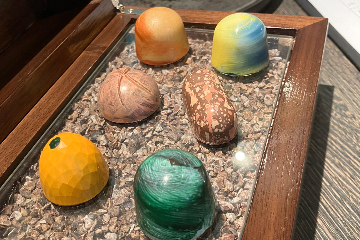 a plate of six very upmarket chocolates