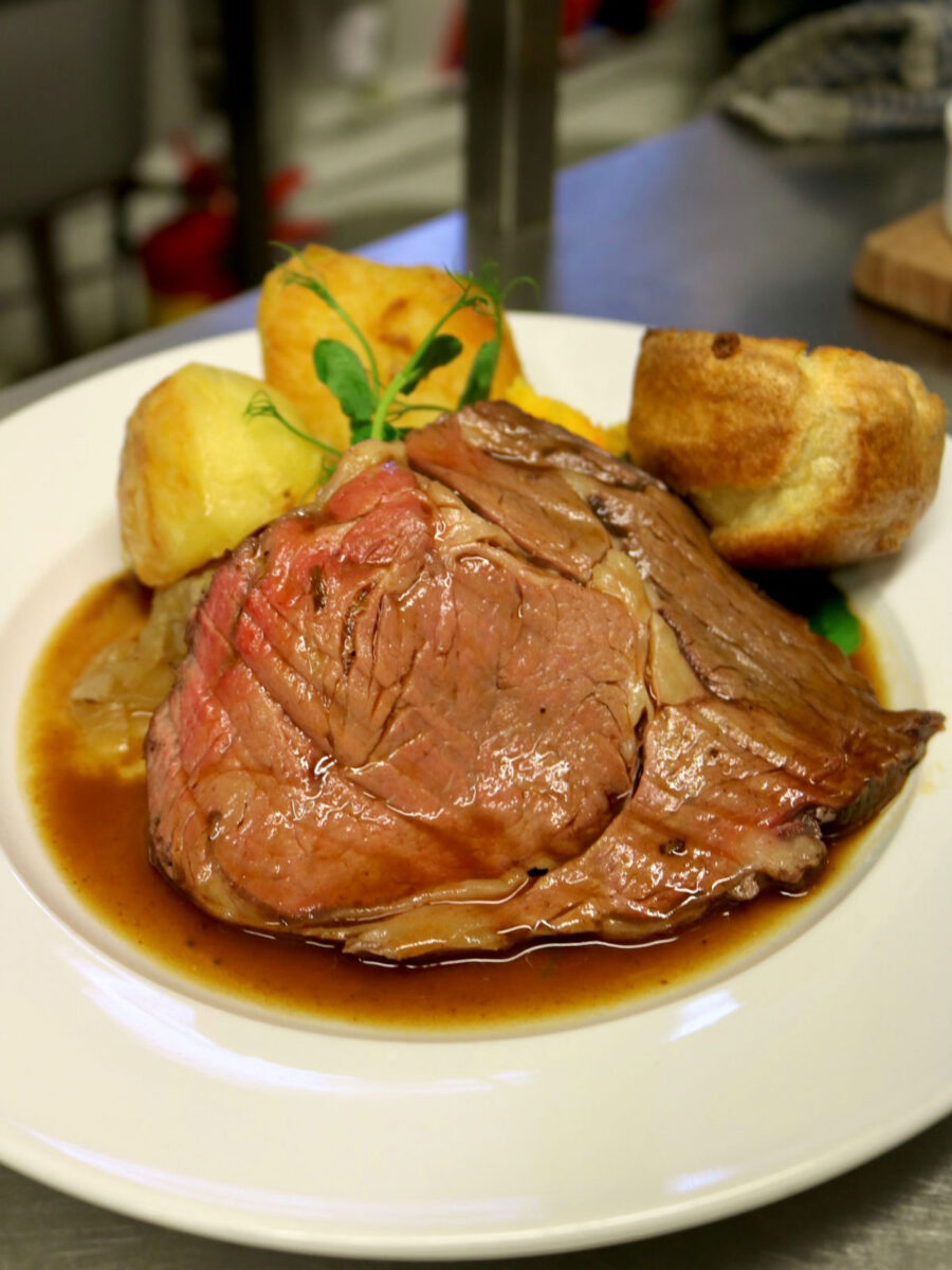 a big plate of roast beef and potatoes