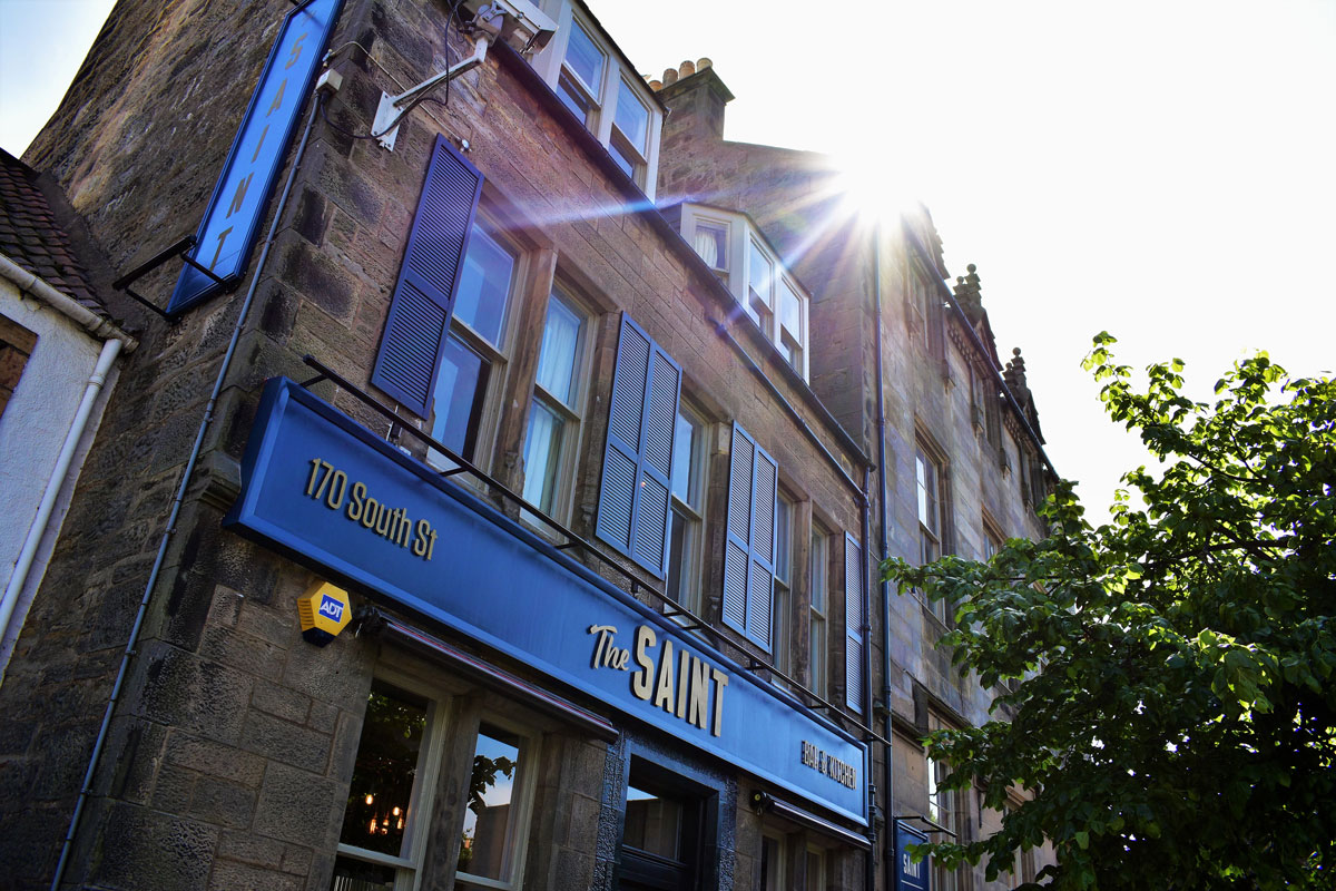 The sun shines over a traditional pub frontage