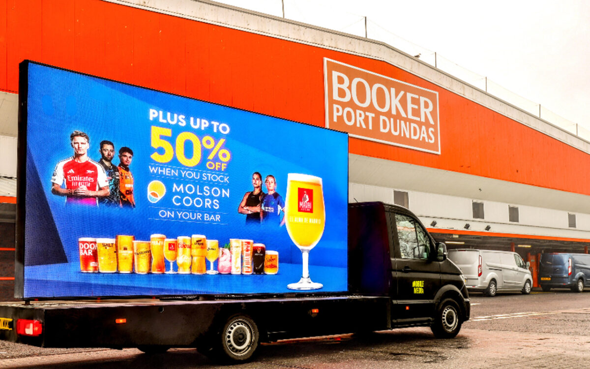 A van towing a billboard advert for Sky Sports.