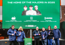 Sky Sports teeing up for Golf Majors coverage A team of people from Sky Sports stand in front of an advertising billboard.