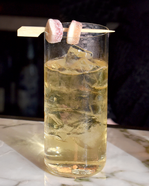 whisky highball cocktail with two jelly sweets balanced on top