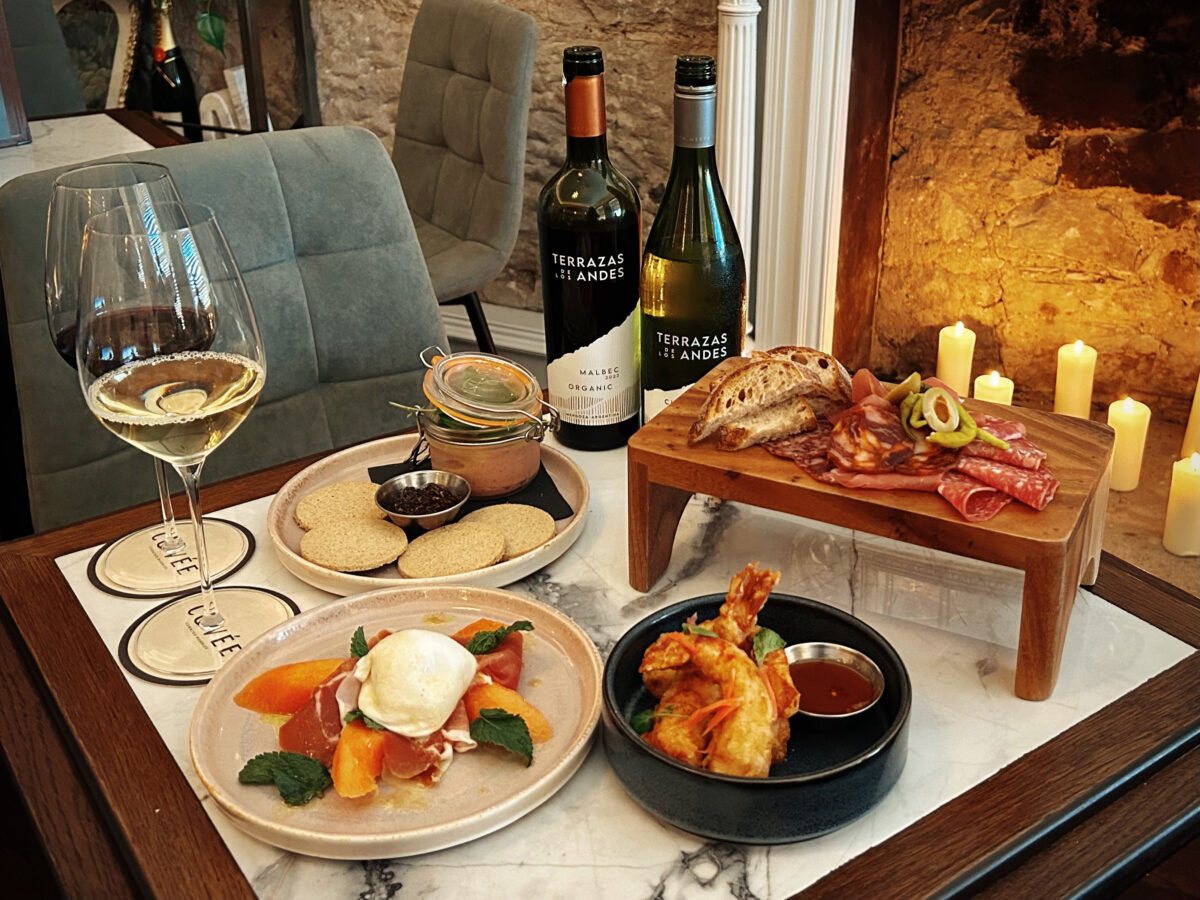 Food and wine on a table at Glasgow bar Cuvee.