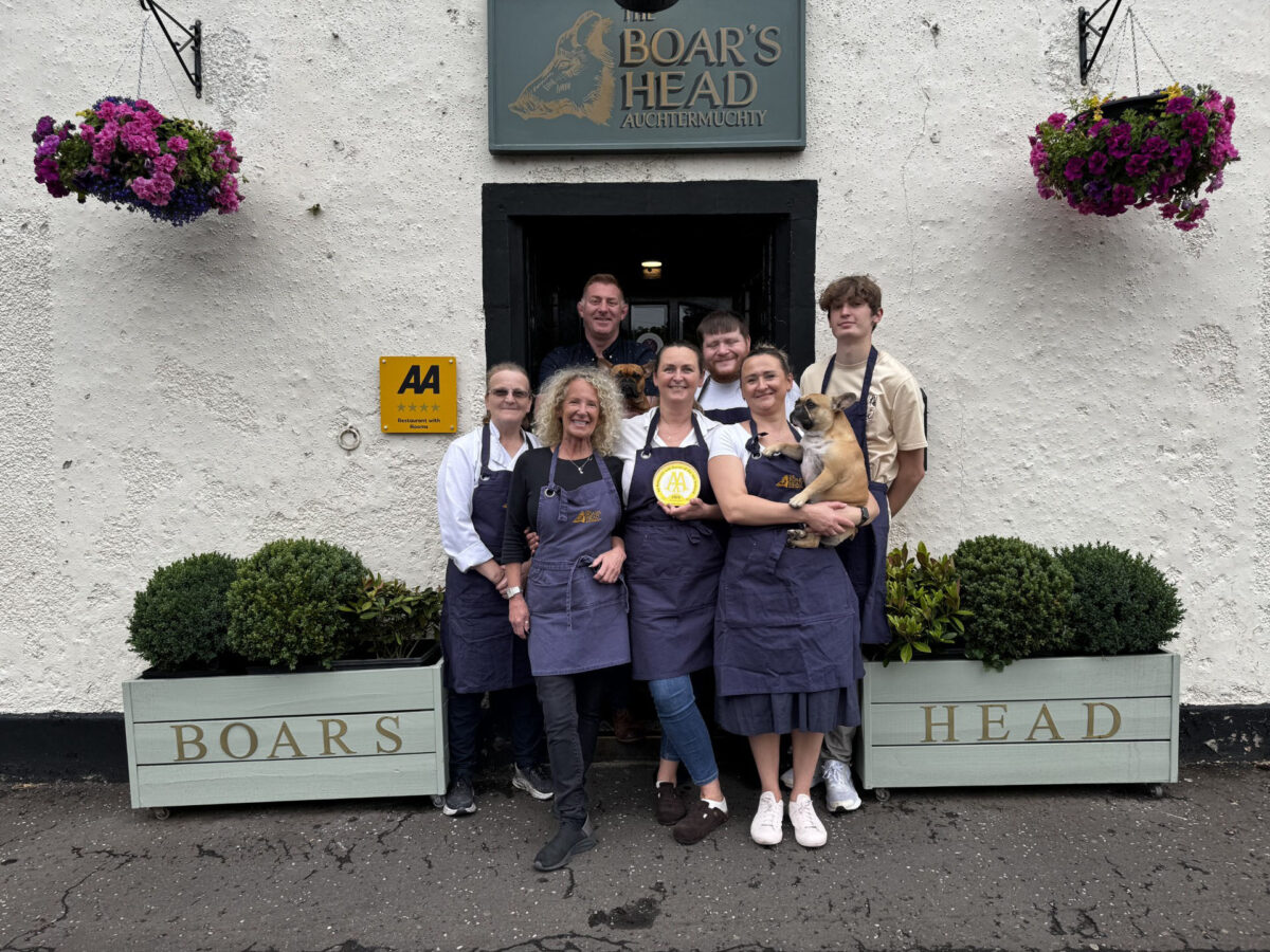 The team from The Boar's Head pose in front of the venue.