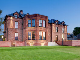 Buzzworks takes to the isles with Arran acquisition The front of the Douglas Hotel in Arran, in the evening light.