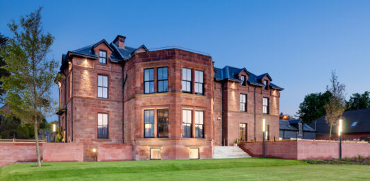 Buzzworks takes to the isles with Arran acquisition The front of the Douglas Hotel in Arran, in the evening light.