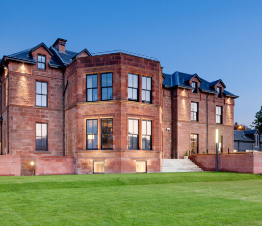 Buzzworks takes to the isles with Arran acquisition The front of the Douglas Hotel in Arran, in the evening light.